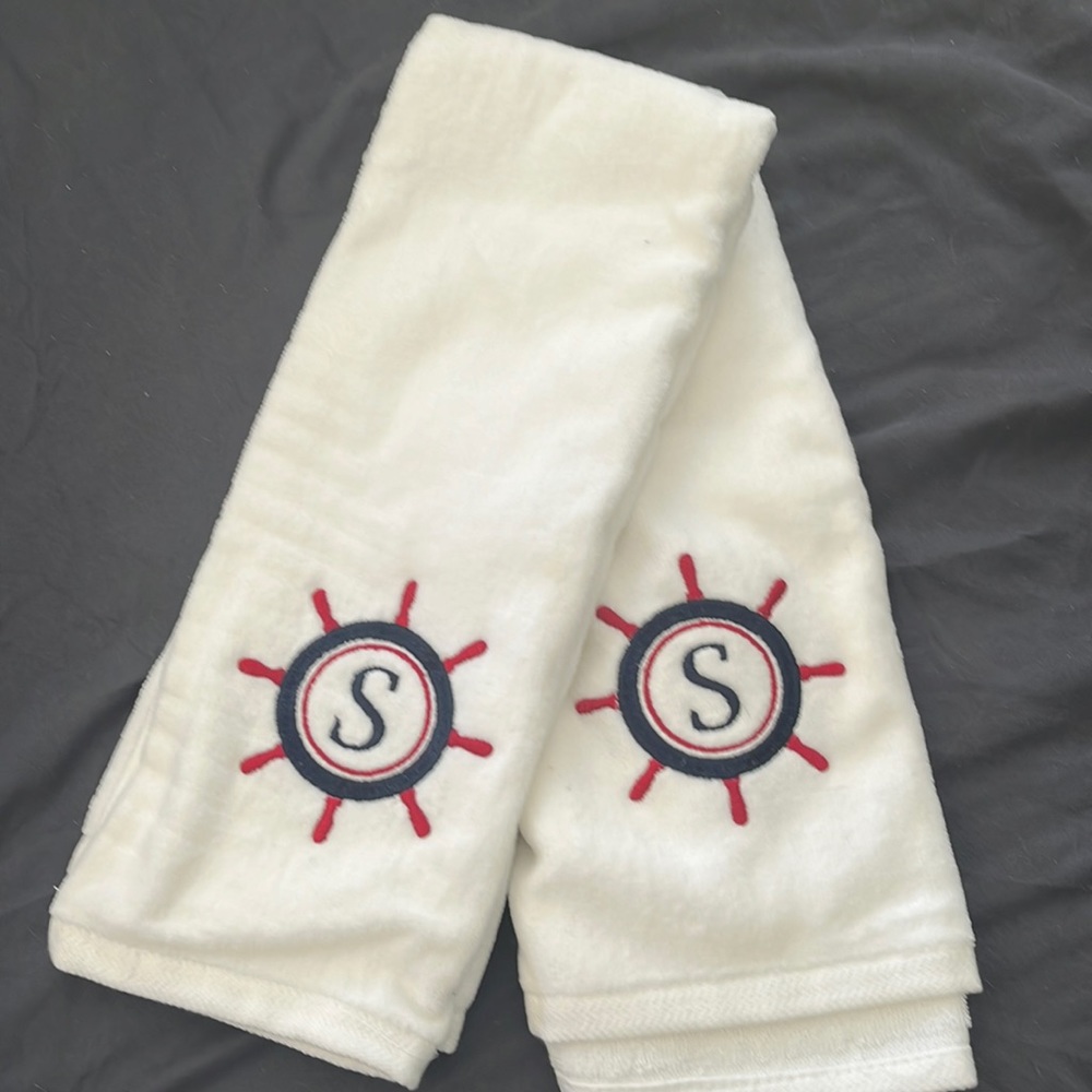 2 monogrammed, hand towels. Never used because they didn’t go with our decor.
